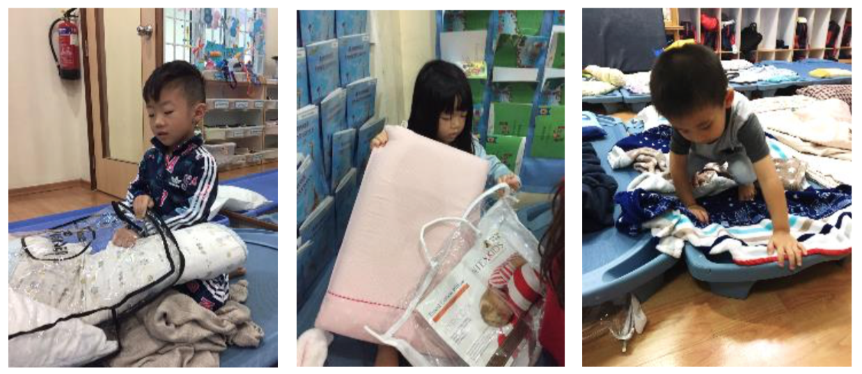 children laid out their bed-sheets and pillows